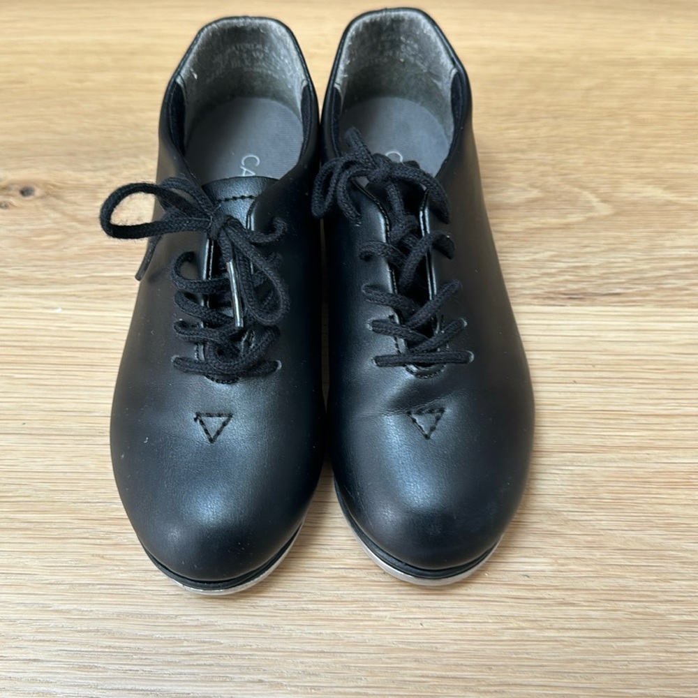 Lace up black tap shoes